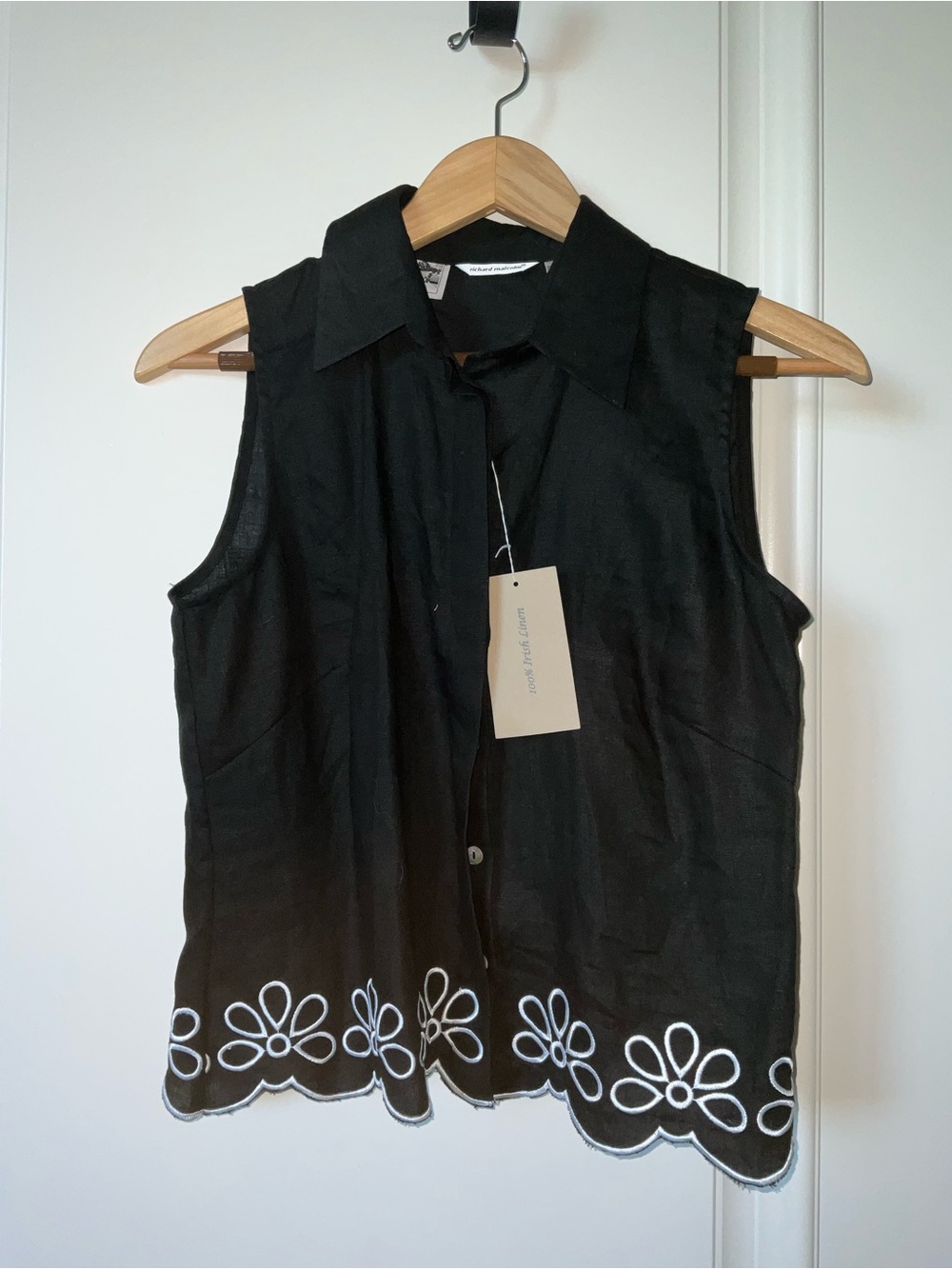 Sleeveless Black Button-Down Top with White Embroidered Hem